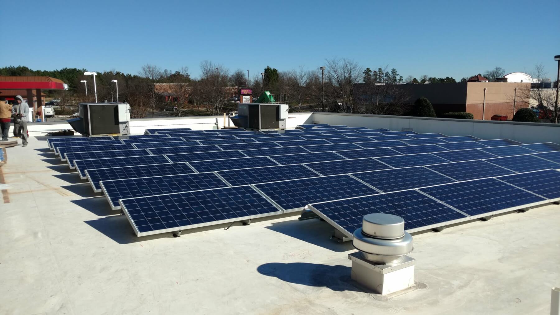 blue solar panel boards on a sunny day